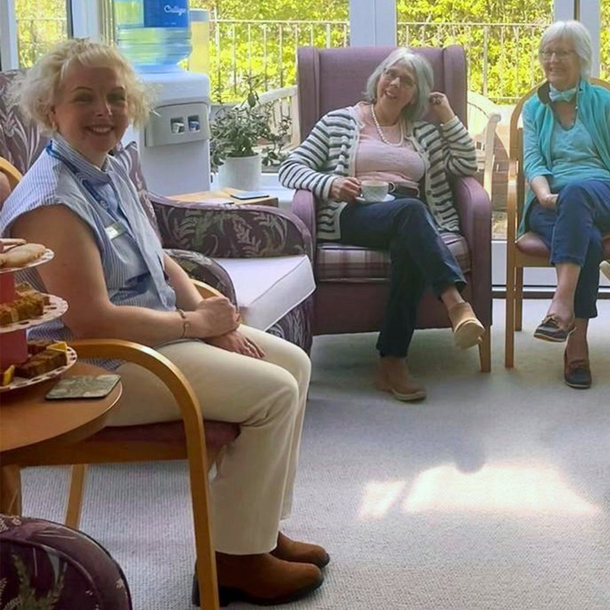 Residents enjoying coffee, tea and homemade treats at a community coffee morning